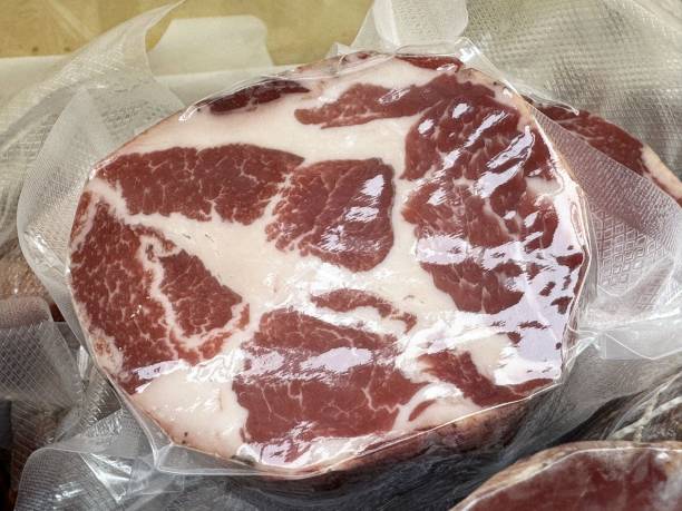 istock Packaged fresh marbled beef steak in vacuum seal on display 2192300078