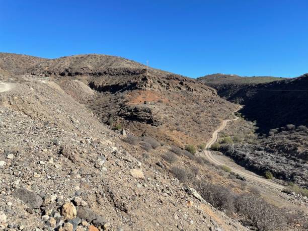 istock Rocky desert landscape with dirt road 2192300135