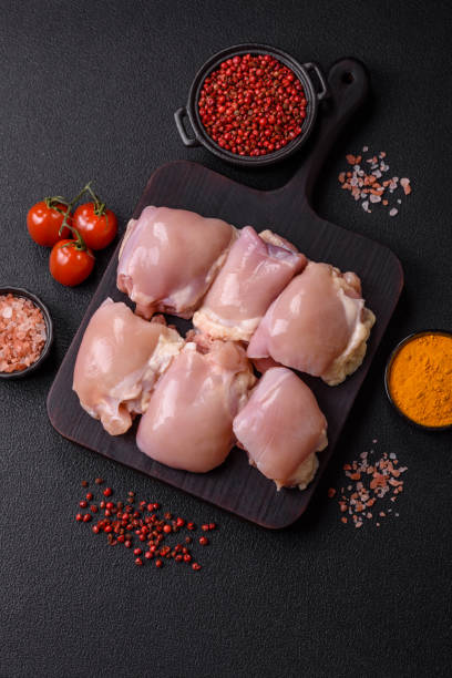 istock Fresh raw chicken thigh fillets with salt, spices and herbs 2192301244