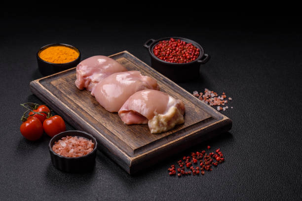 istock Fresh raw chicken thigh fillets with salt, spices and herbs 2192301290
