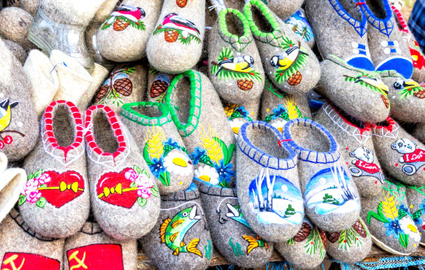 Traditional russian felted boots of different design and patterns. Embroidered felt boots for winter season. Russian national shoes felted boots