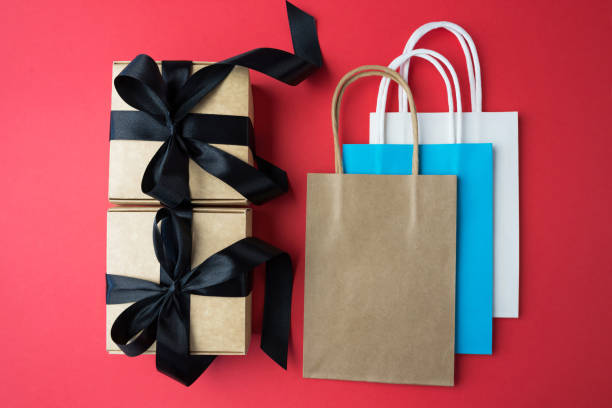 istock Gift boxes and bags on red background. Black Friday sales. Banner. 2192308179