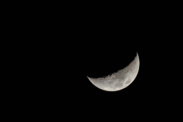 Moon in the night sky just after the New Moon during the waxing crescent towards becoming full again.