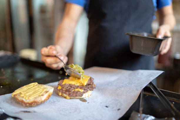 istock Close-up on a chef preparing burgers at a restaurant 2192310046