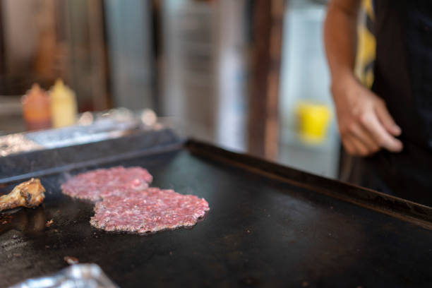 Asian women are choosing beef in the supermarket.