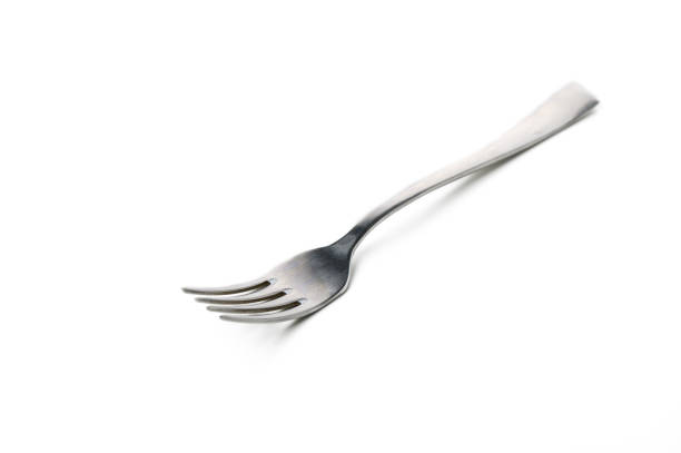 istock Unique silver fork with elongated tines resting on a plain white surface at midday 2192311971