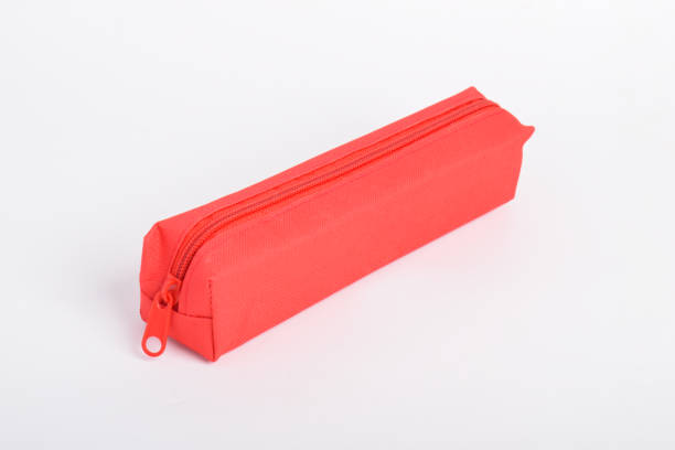Red school pencil case isolated on white background. School stationery. Back to school. Copy space