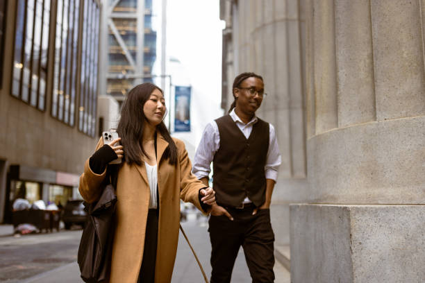 istock Lunch Break Walk - Professional Colleagues Strolling in Urban Setting 2192324051