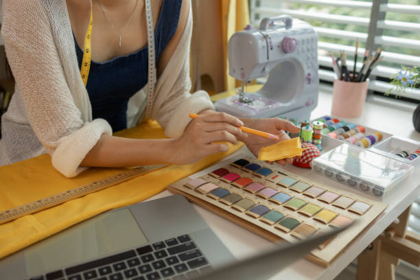 istock Design professional marking on fabric, designer working in the studio, tailor adjusts garment design on mannequin in workshop - fashion atelier, Woman measuring fabric in fashion design studio 2192326728