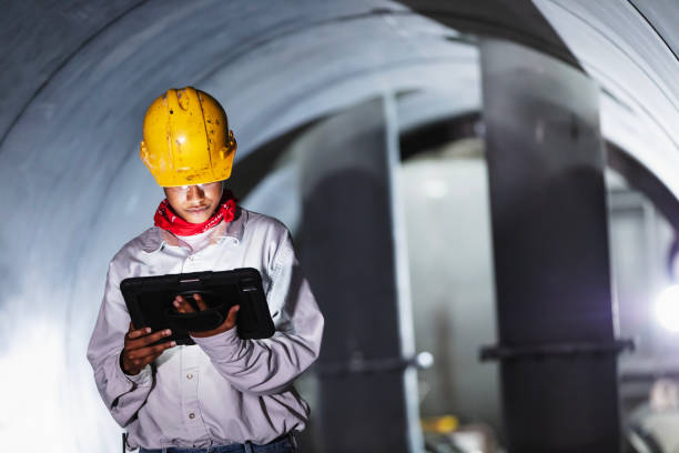 istock African-American woman in factory using digital tablet 2192329587