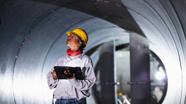 istock African-American woman in factory using digital tablet 2192329593