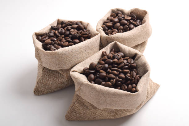 Stacked Burlap Bags of Coffee Beans in a Warehouse