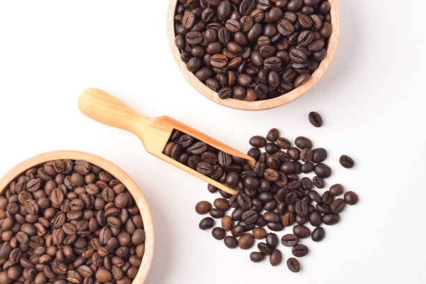 istock Coffee beans in wooden bowl 2192331621