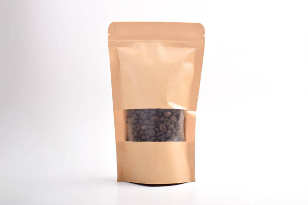 istock Brown Kraft paper bag with coffee beans 2192331632