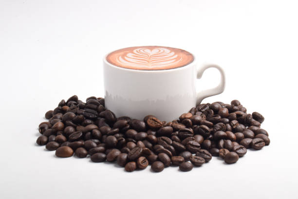 Coffee with Latte Art and Coffee Beans Isolated on White Background