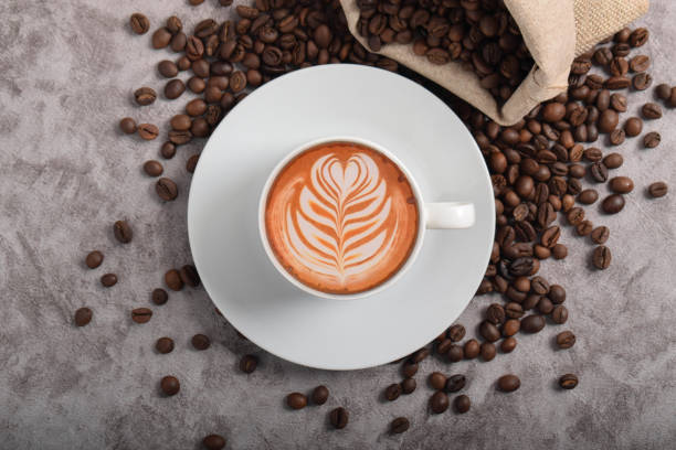 istock Cup of coffee latte and coffee beans 2192332722