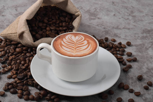 istock Cup of coffee latte and coffee beans 2192332724