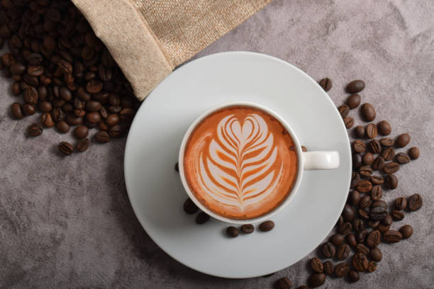 istock Cup of coffee latte and coffee beans 2192332741
