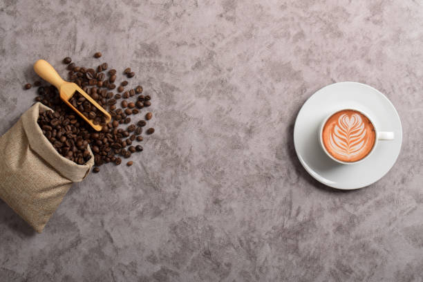 istock Cup of coffee and coffee beans in a sack 2192332746
