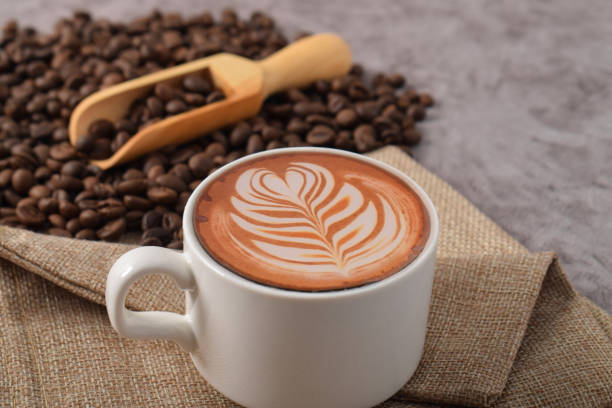 istock Cup of coffee latte and coffee beans 2192332760