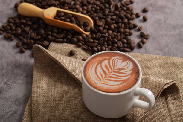 istock Cup of coffee latte and coffee beans 2192332764