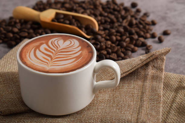 istock Cup of coffee latte and coffee beans 2192332774