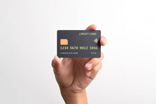 istock Hand holding black credit card 2192334019
