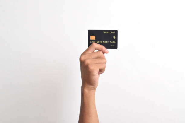 istock Hand holding credit card on white background 2192334038