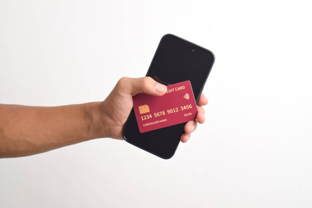 istock Hands holding mobile phone and credit card 2192336094