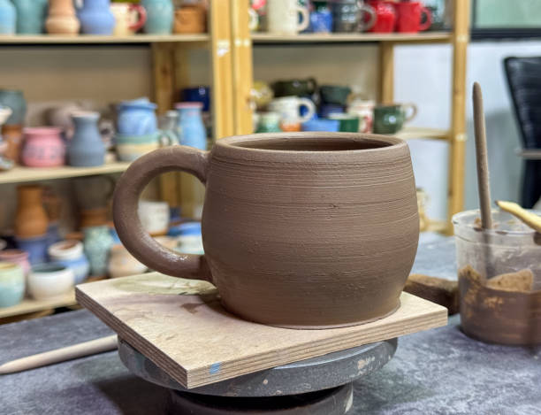 istock The process of painting a ceramic vase during a masterclass. Creativity and attention to detail in every brushstroke, creating a unique ceramic artwork. 2192336275