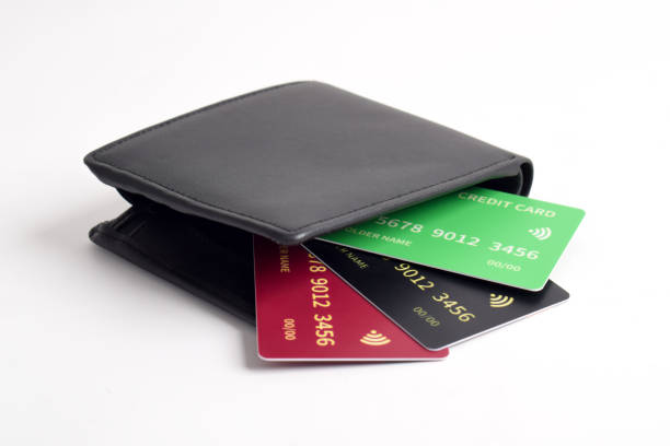 Black leather wallet with credit cards isolated on white background