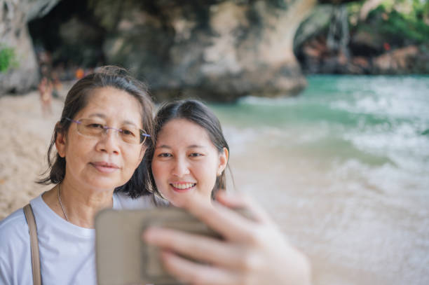 istock A mother and daughter take a selfie beachside selfie with a scenic backdrop 2192339450