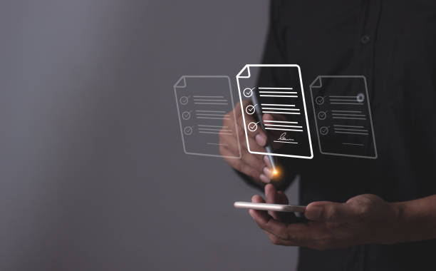 istock Young man with smartphone mobile hand using a pen touching to sign a Online Business Contract, Contract signing, Electronic signature, Digital documents, Future smart contract 2192344176