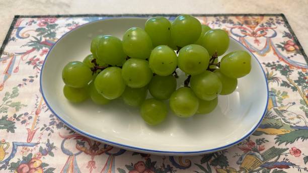 istock Fresh Green Grapes on a Decorative Plate 2192348402