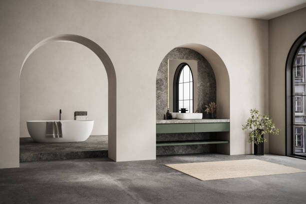 istock Modern minimalist bathroom interior, modern bathroom cabinet, white sink marble countertop, interior plants, bathroom accessories, bathtub, beige walls, concrete floor, arches. 2192348683