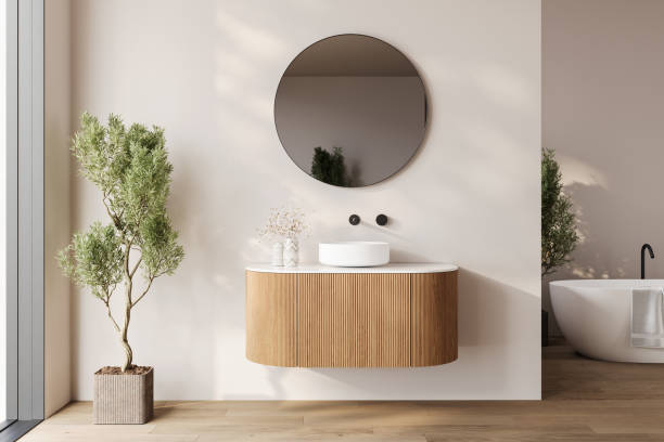 istock Modern bathroom interior with dark brown parquet floor, two sinks, double mirrors, white bathtub, interior plants, 2192348687