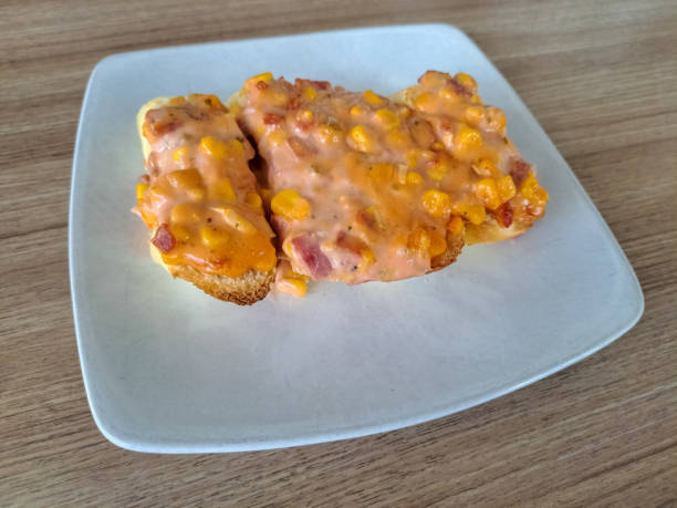 Tasty Deluxe Beef Bruschetta With Toasted Grilled Bread, Smoked Beef, Corn, Onion And Thousand Island Dressing Sauce. Appetizer Food Menu.