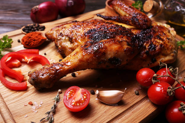 istock Roasted chicken with spices and vegetables 2192351996