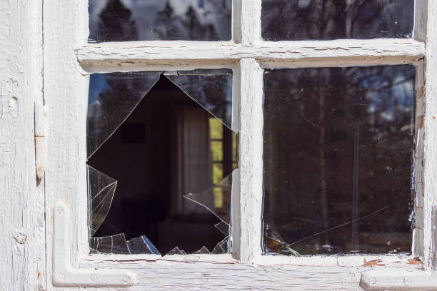 istock Broken glass in a window on a cottage 2192354879