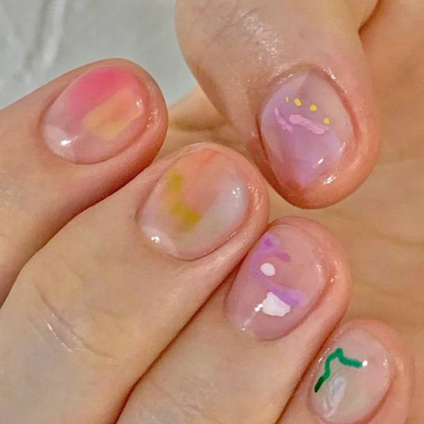 istock Creative nail art featuring intricate designs, vibrant colors, and unique patterns. Perfect for beauty and fashion photography, showcasing trends in nail designs and the artistry of manicure techniques. 2192355915