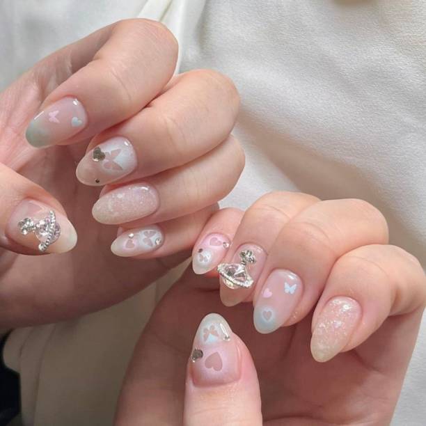 istock Creative nail art featuring intricate designs, vibrant colors, and unique patterns. Perfect for beauty and fashion photography, showcasing trends in nail designs and the artistry of manicure techniques. 2192356017