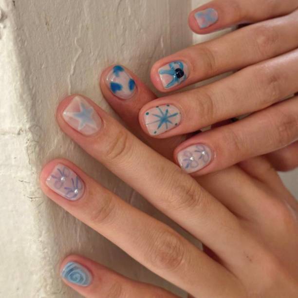 istock Creative nail art featuring intricate designs, vibrant colors, and unique patterns. Perfect for beauty and fashion photography, showcasing trends in nail designs and the artistry of manicure techniques. 2192356062