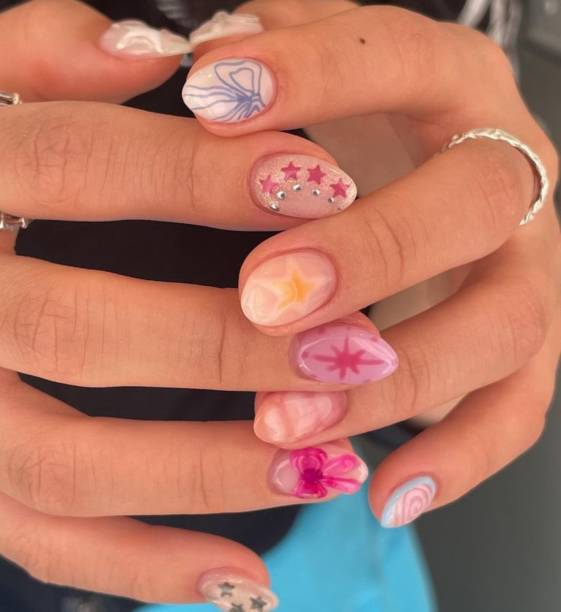 istock Creative nail art featuring intricate designs, vibrant colors, and unique patterns. Perfect for beauty and fashion photography, showcasing trends in nail designs and the artistry of manicure techniques. 2192356274