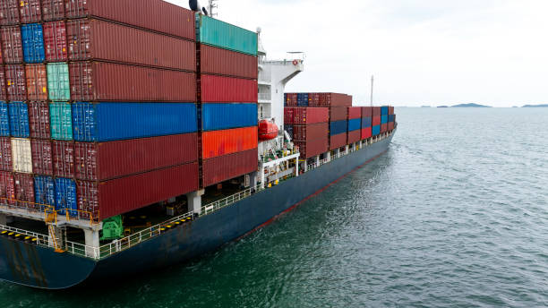 istock cargo logistic container ship sailing in sea, import export goods and distributing products to dealer and consumers across worldwide, container shiping service  concept. 2192360450