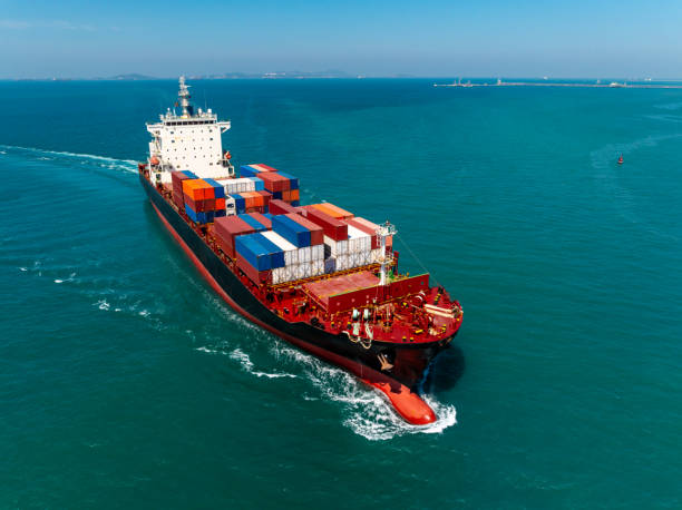 istock cargo logistic container ship sailing in sea, import export goods and distributing products to dealer and consumers across worldwide, container shiping service  concept. 2192360474