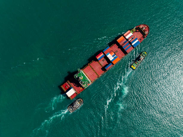 istock aerial view cargo logistic container ship sailing in sea, import export goods and distributing products to dealer and consumers across worldwide, 2192360483