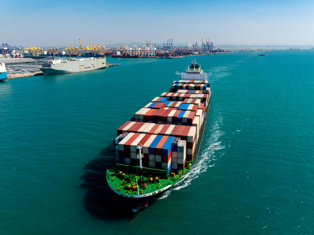 istock cargo logistic container ship sailing in sea, import export goods and distributing products to dealer and consumers across worldwide, container shiping service  concept. 2192360485
