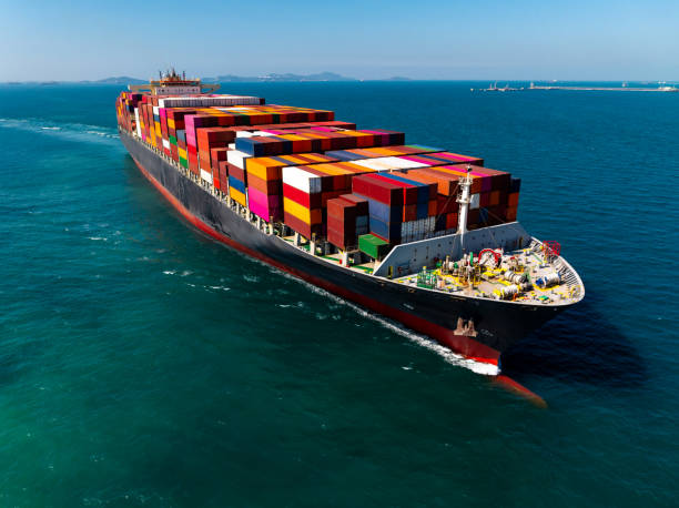 istock cargo logistic container ship sailing in sea, import export goods and distributing products to dealer and consumers across worldwide, container shiping service  concept. 2192360511