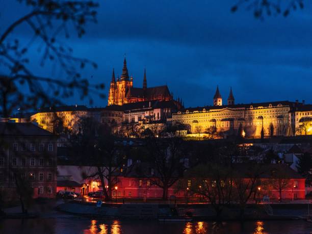istock Prague Castle illuminated at night with reflections on the Vltava River. 2192360819