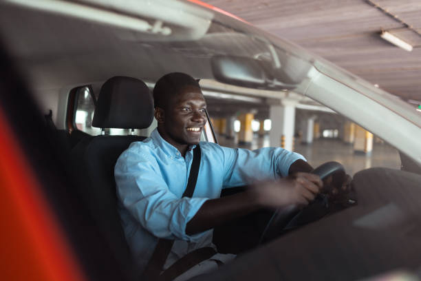 istock Smiling black man driving his car 2192366472